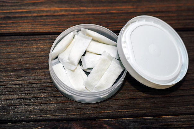 Closeup of snus can filled with white snus portions